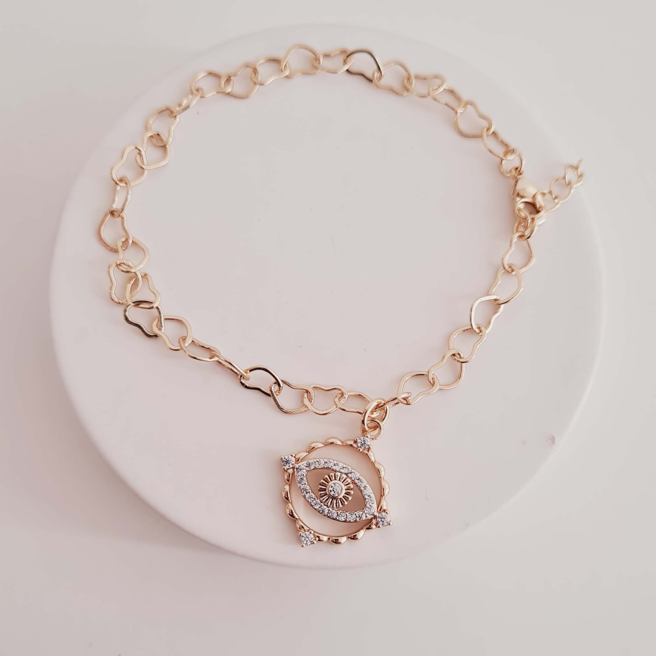 Pulseira de Elos de Corações Lisos com Pingente de Olho Grego Banhado a Ouro 18K