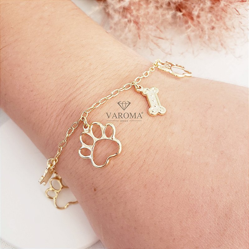 Pulseira com pingente de patinha e ossinho banhada  em ouro 18k