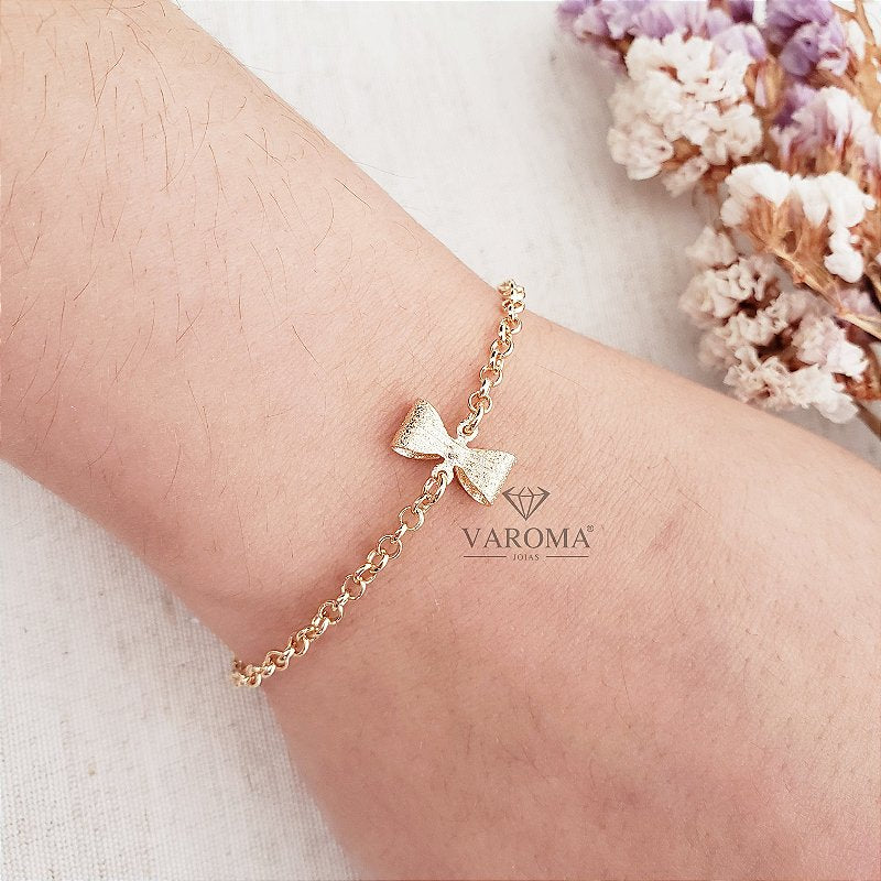 Pulseira infantil com lacinho banhada em ouro 18k